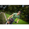 Young man riding his mountain bike outdoors on a forest path