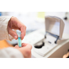 Researcher carrying out scientific research in a lab (shallow DOF; color toned image)