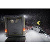 car accident on slippery winter road at night with heavy snow fall and paramedic ambulance first aid car