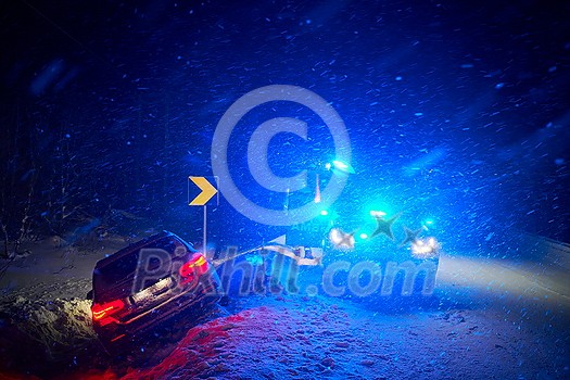 car accident on slippery winter road at night with heavy snow fall and paramedic ambulance first aid car car accident on slippery winter road at night with heavy snow fall and paramedic ambulance first aid car