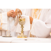 Priest during a wedding ceremony/nuptial mass (shallow DOF; color toned image)