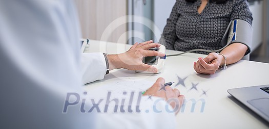 Blood pressure health check , High Blood Pressure check blood pressure of a patient in hospital, selective focus, shallow DOF