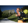 Pretty, female climber on a via ferrata -  climbing on a rock in Swiss Alps - Approach phase