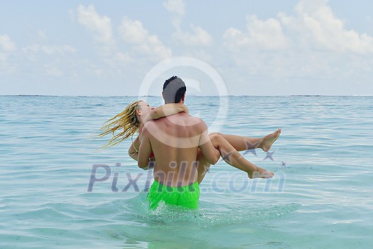 happy young  couple at summer vacation have fun and relax at beautiful sunny  day