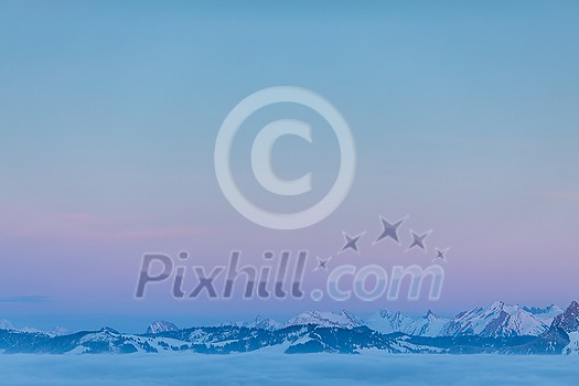 Splendid apline scenery. High mountains with fog and lovely evening light. Splendid apline scenery. High mountains with fog and lovely evening light.