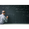 Math teacher drawing   fuction graph on a blackboard during mathclass (motion blurred image)