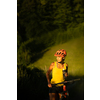 Pretty, young woman biking on a mountain bike enjoying healthy active lifestyle outdoors in summer (shallow DOF)