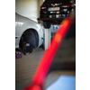 Tyre change - wheel balancing or repair and change car tire at auto service garage or workshop by mechanic