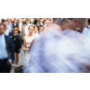 Crowd of people walking on city street - motion blurred image with unrecognizable faces - Young woman standing still, feeling down, depressed