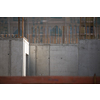 Construction site with a concrete slab and walls reinforced with steel