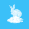 Fluffy Easter bunny made from white cloud on a pastel sky blue background with copy space. Congratulation Happy Easter card.