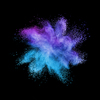 Decorative abstract powder burst or explosion in blue and violet colors on a black background with copy space.
