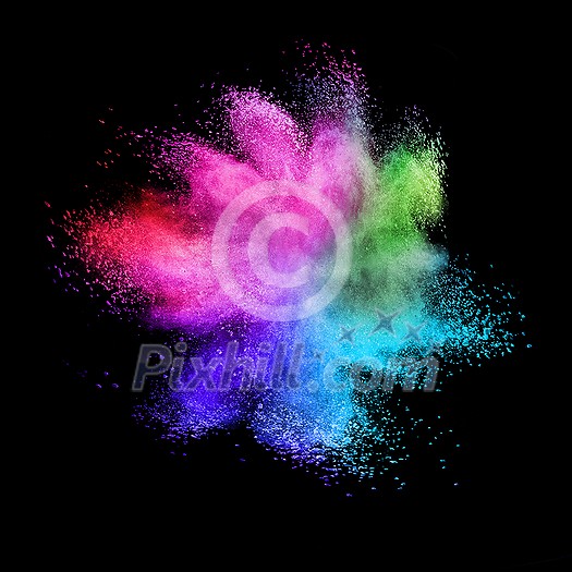 Decorative abstract chaotic colorful powder splash or explosion on a black background with copy space.
