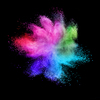 Decorative abstract chaotic colorful powder splash or explosion on a black background with copy space.