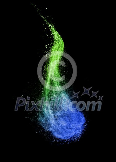 Creative powder splash or explosion in blue and green colors in the shape of curved cloud on a black background with copy space.