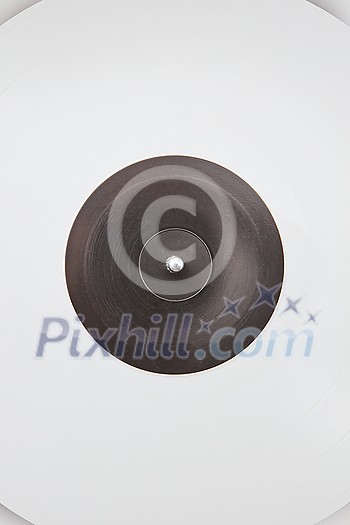 White vinyl record rotate background. Old fashioned turntable player. Sound technology for DJ to mix and play music. White vinyl record rotate background. Old fashioned turntable player. Sound technology for DJ to mix and play music.