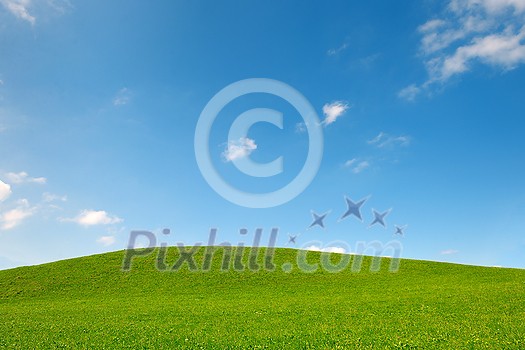 green field of grass and perfect blue  sky background in nature
