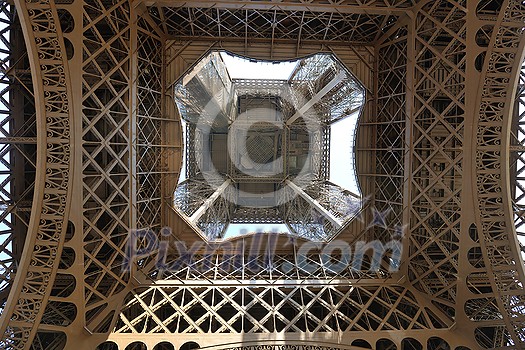 Eiffel Tower in Paris against a dramatic blue sky at day tourist and travel attraction