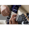 Close up of male hands playing electric guitar