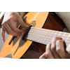 Close up of male hands playing acoustic guitar