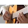 Close up of male hands playing acoustic guitar