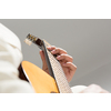 Close up of male hands playing acoustic guitar