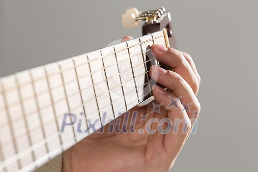 Close up of male hands playing acoustic guitar Close up of male hands playing acoustic guitar