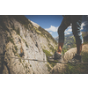Man on a via ferrata, walking on an iron rope. Kandersteg - amazing vacation destination in the Swiss Alps, Switzerland
