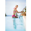 Young woman in a swimming pool enjoying days of summer