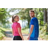 young happy couple enjoying in a healthy lifestyle while jogging on a country road through the beautiful sunny forest, exercise and fitness concept