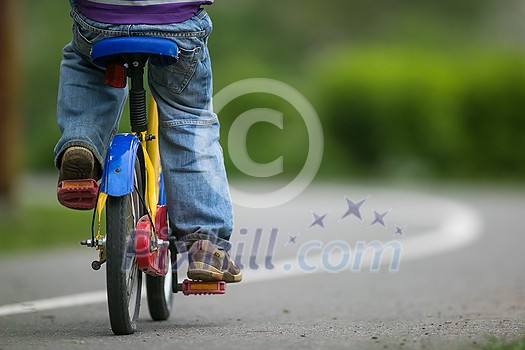 Little cyclist on a little bike (shallow DOF) Little cyclist on a little bike (shallow DOF)