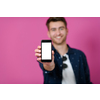 covid passport, a young man shows his code and covid passport on his cell phone while posing in front of a pink background