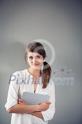 Confident young woman in casual clothing with copy space. Successful smiling woman