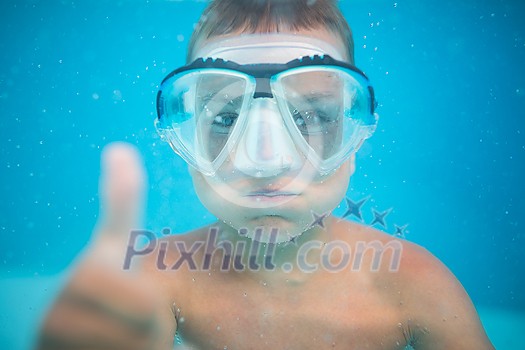 Cute little boy in a swimming pool