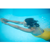 Gorgeous young woman in a pool, jumping and diving underwater, having fun