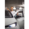 Underground parking/garage (shallow DOF; color toned image) - young woman with her car in the underground parking