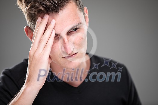 Fear/anxiety/regret/uncertainty in a young man - effects of a difficult life situation - vivid emotions concept Fear/anxiety/regret/uncertainty in a young man - effects of a difficult life situation - vivid emotions concept