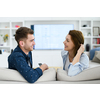 a young married couple enjoys sitting in the large living room, a young couple spending their time together
