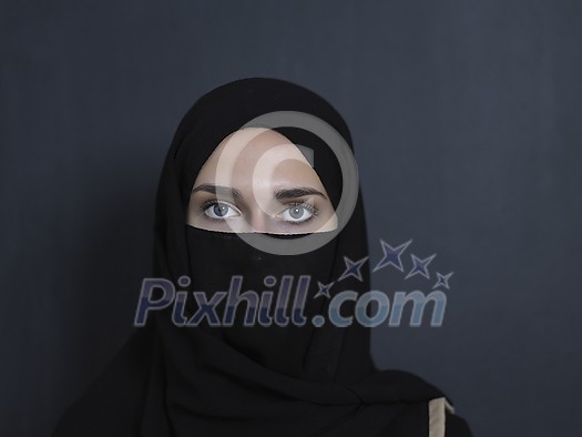 Portrait of muslim woman wearing niqab and traditional arabic clothes or abaya. Arab woman representing modern arabic lifestyle, islamic  fashion and Ramadan kareem concept