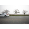 Motion blurred truck going fast on a rural road