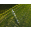 Farmland from above - aerial image of a lush green field being irrigated