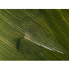 Farmland from above - aerial image of a lush green field being irrigated