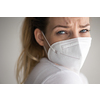 Young woman wearing a face mask during coronavirus and flu outbreak. Virus and illness protection, home quarantine. COVID-19 concept