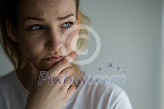 Anxious, worried, stressed young woman looking pensive, pondering, deep in thoughts. Anxious, worried, stressed young woman looking pensive, pondering, deep in thoughts.