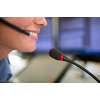 Call centre  employee communicating over phone using an external microphone for better sounf and ergonomics