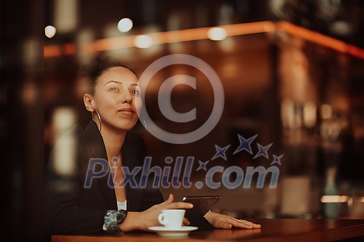 a businesswoman sitting in a cafe on a break and using a tablet a businesswoman sitting in a cafe on a break and using a tablet