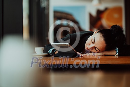 the freelance Latina he has resting sleeping after hard work long time in a coffee shop. High-quality photo
