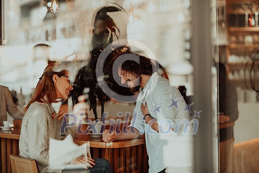 a woman in glasses and men with afro hair sit in a cafe and talk about business projects a woman in glasses and men with afro hair sit in a cafe and talk about business projects