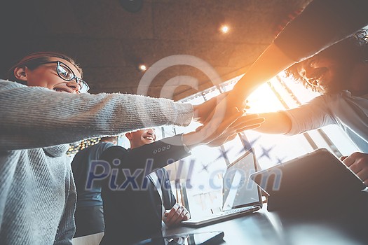 young business people putting their hands together. Stack of hands. Unity and teamwork concept. young business people putting their hands together. Stack of hands. Unity and teamwork concept.
