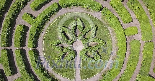 Aerial view of beautiful green natural labyrinth and roads at botanical garden in city in summer day, zoom out Aerial view of beautiful green natural labyrinth and roads at botanical garden in city in summer day, zoom out